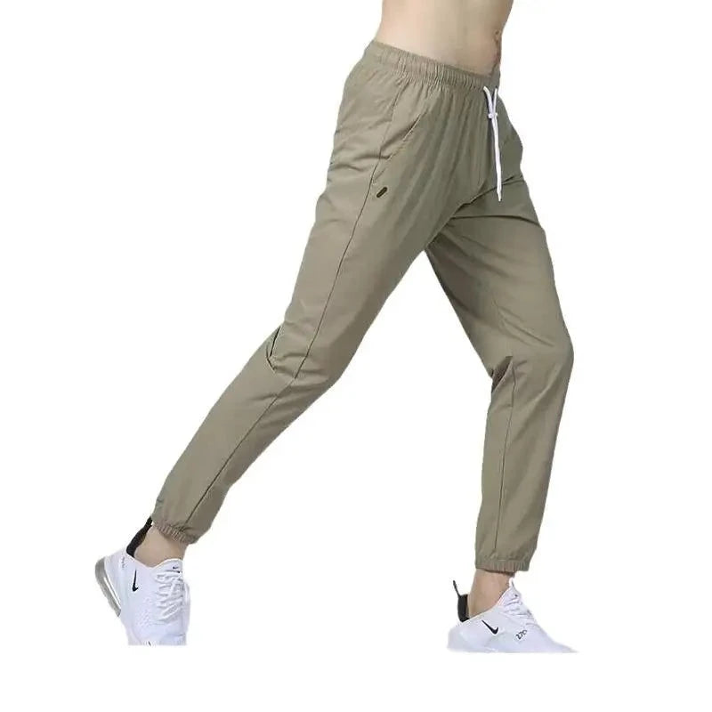 Men's pants with old-school design-Men's Nylon Mid Elastic Waist Closure Solid Pattern Casual Trousers